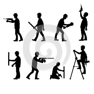 Silhouette of a ÃÂonstruction workers, working with tools photo